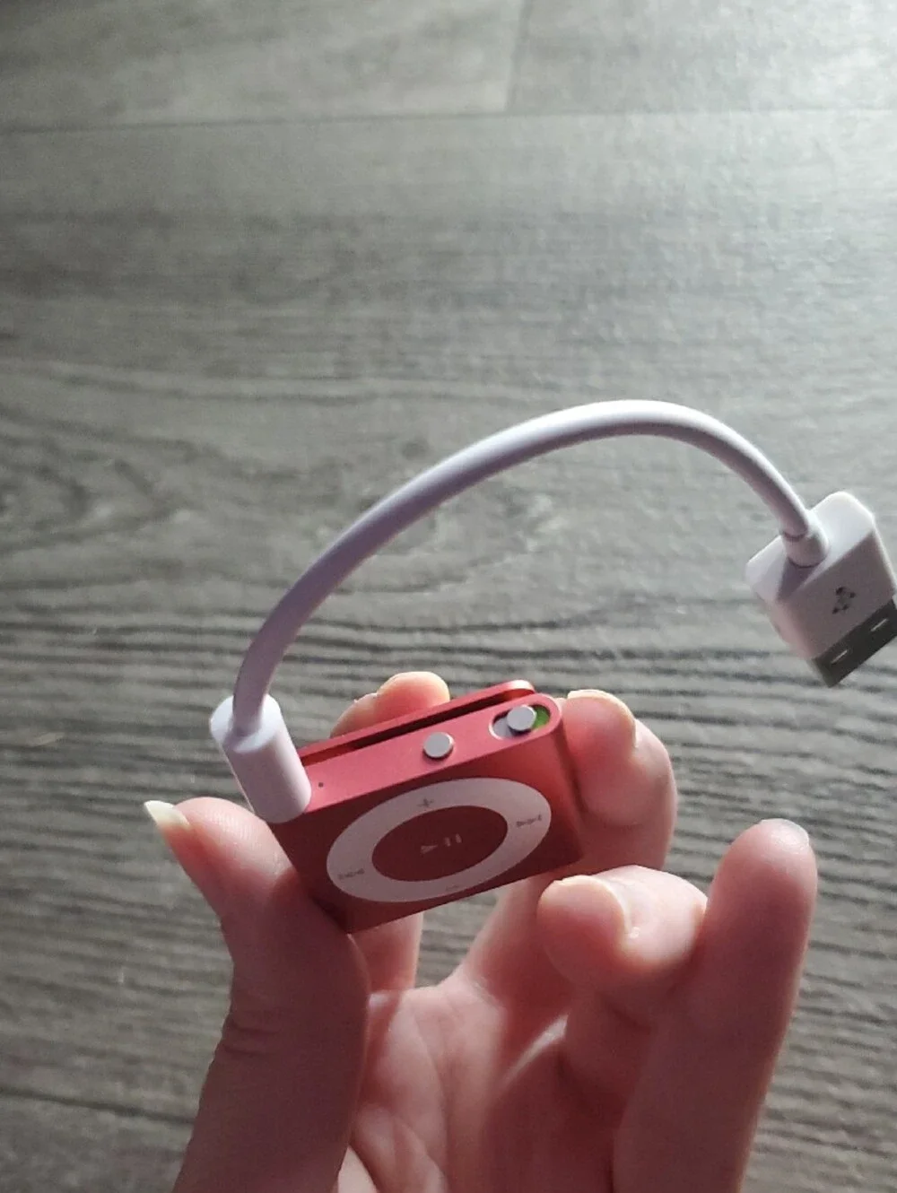 Vintage pink Apple iPod Shuffle (4th Generation, 2GB storage, Model A1373).